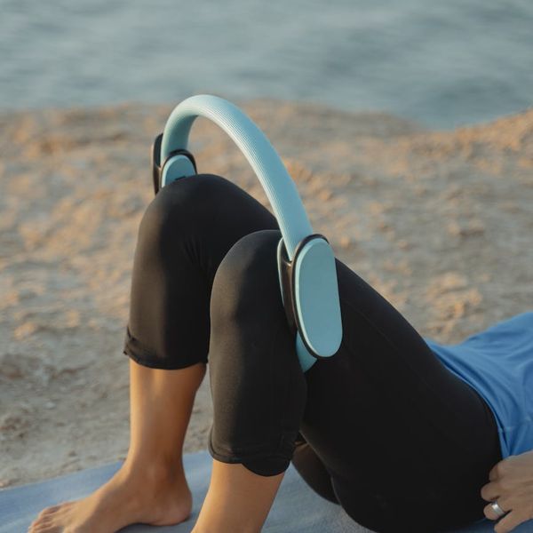 Person stretching outdoors during a beautiful sunset.